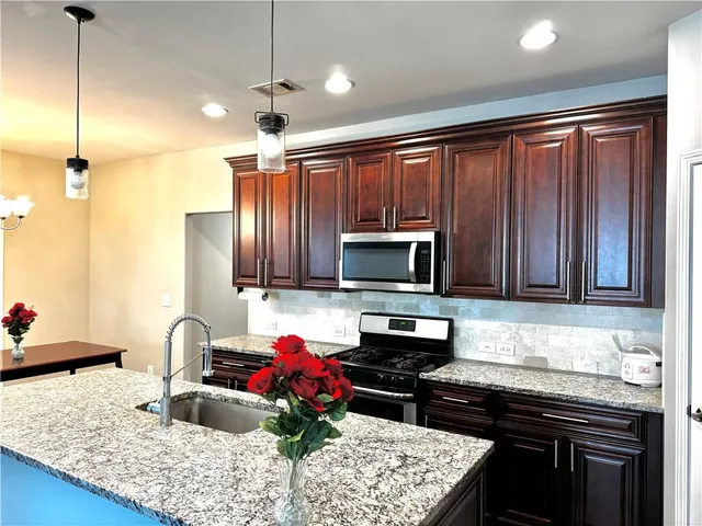 a bed sitting in a bedroom next to a small yard