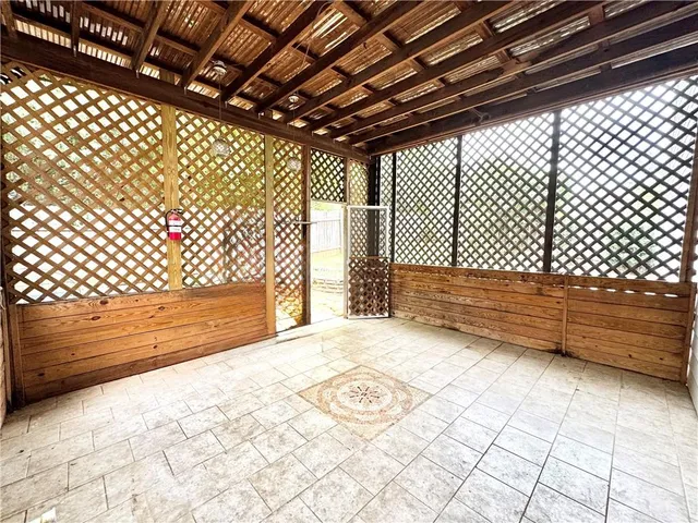 a view of a backyard with sitting area