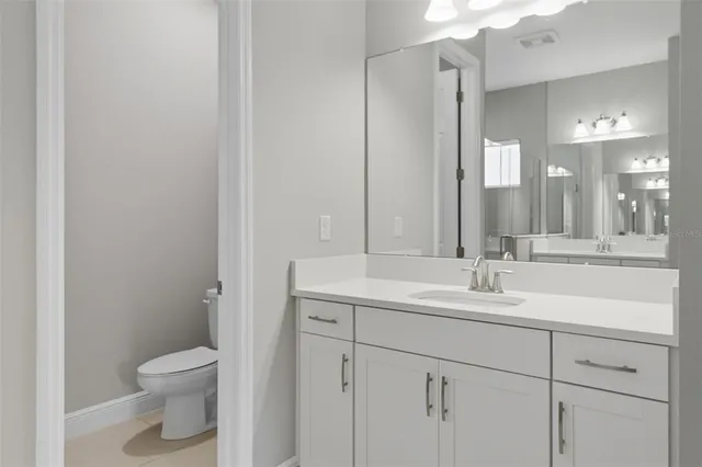 a view of a house with yard and a garden