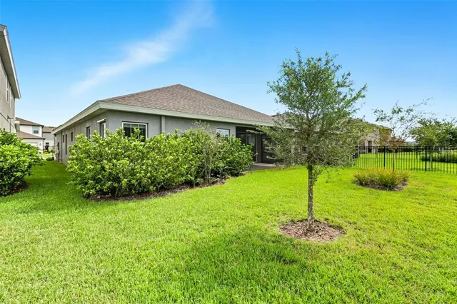 a room with lots of furniture and a view of dining room