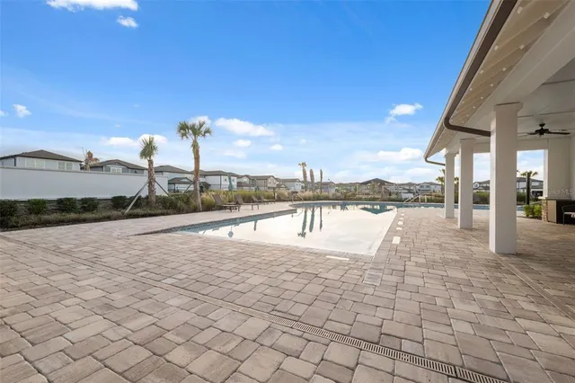a view of a swimming pool with a patio