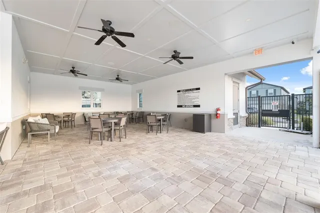 swimming pool view with a seating space