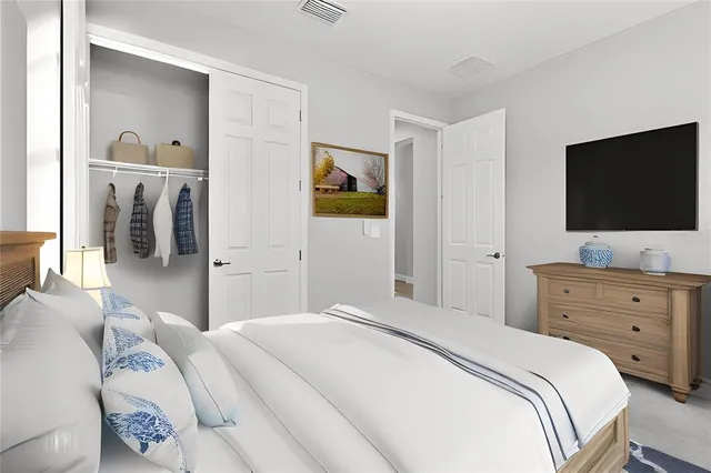 a view of a living room and kitchen with furniture