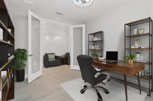 a living room with fireplace furniture and a large window