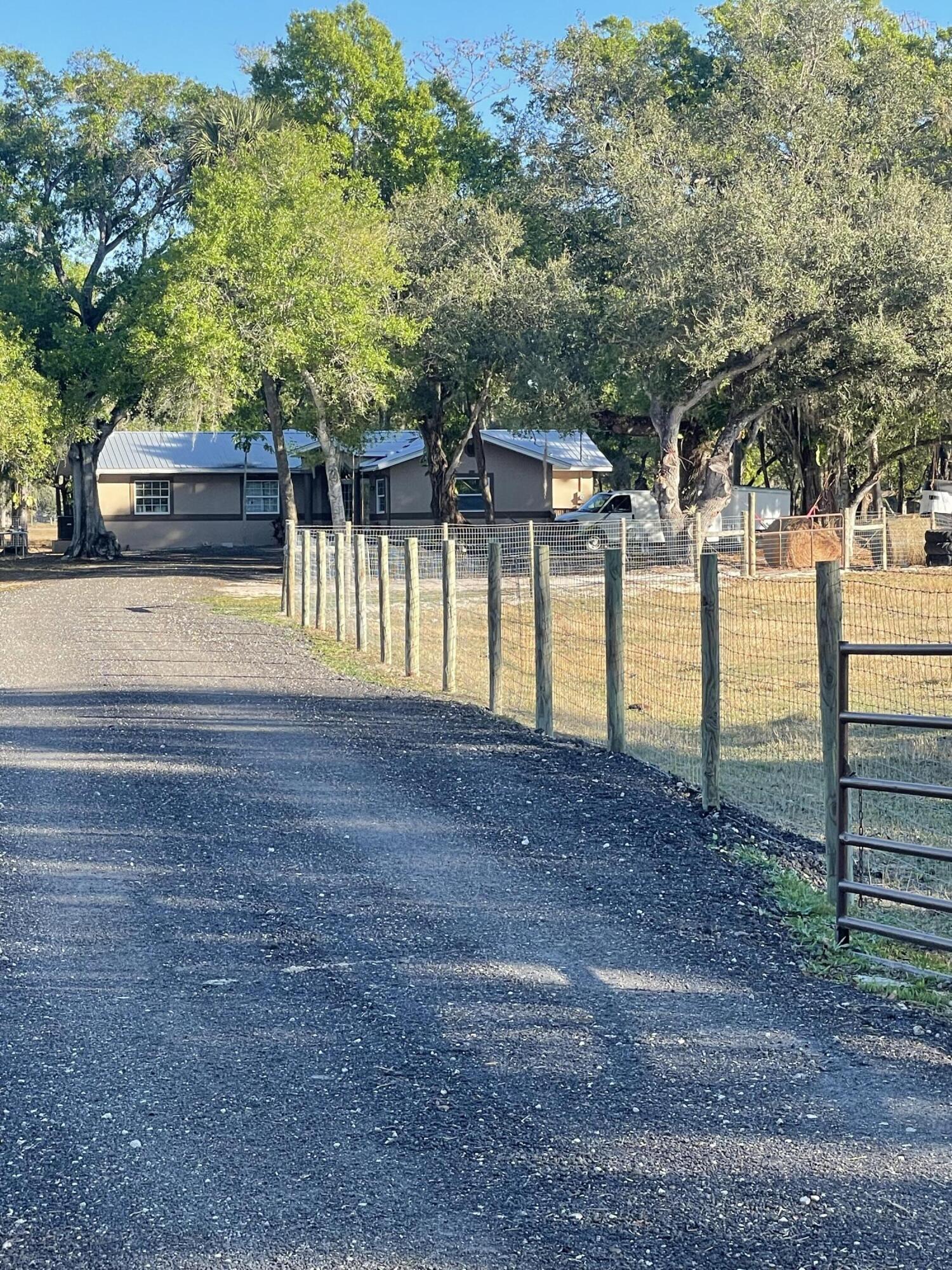 1220 A Road LaBelle, FL 33935 - Photo 35 of 42 a view of a yard with an trees