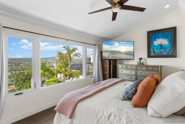 a very nice looking room with a large window and chandelier
