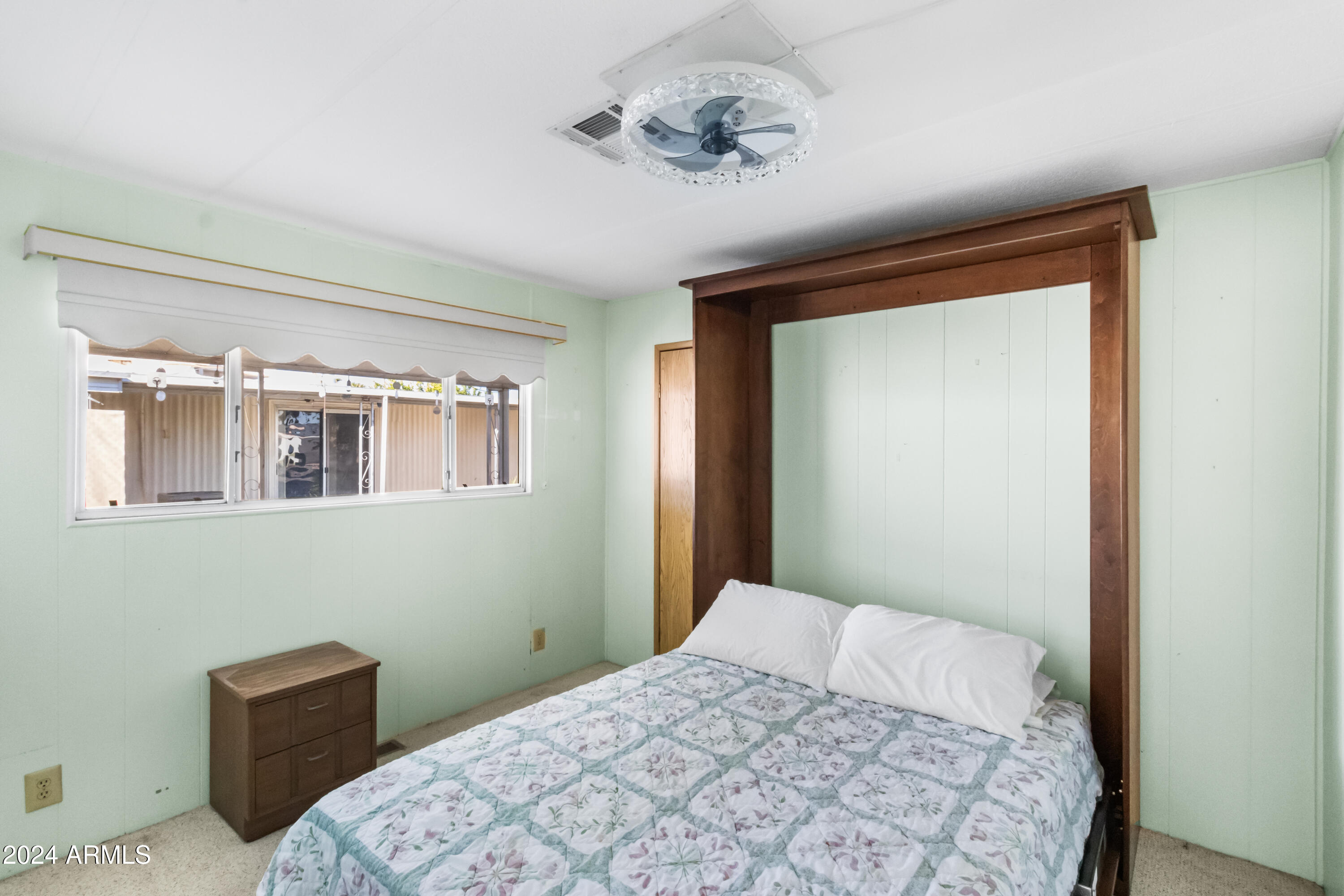 2100 North Trekell Road, Unit 204 Casa Grande, AZ 85122 - Photo 17 of 27 a bedroom with a bed and a window