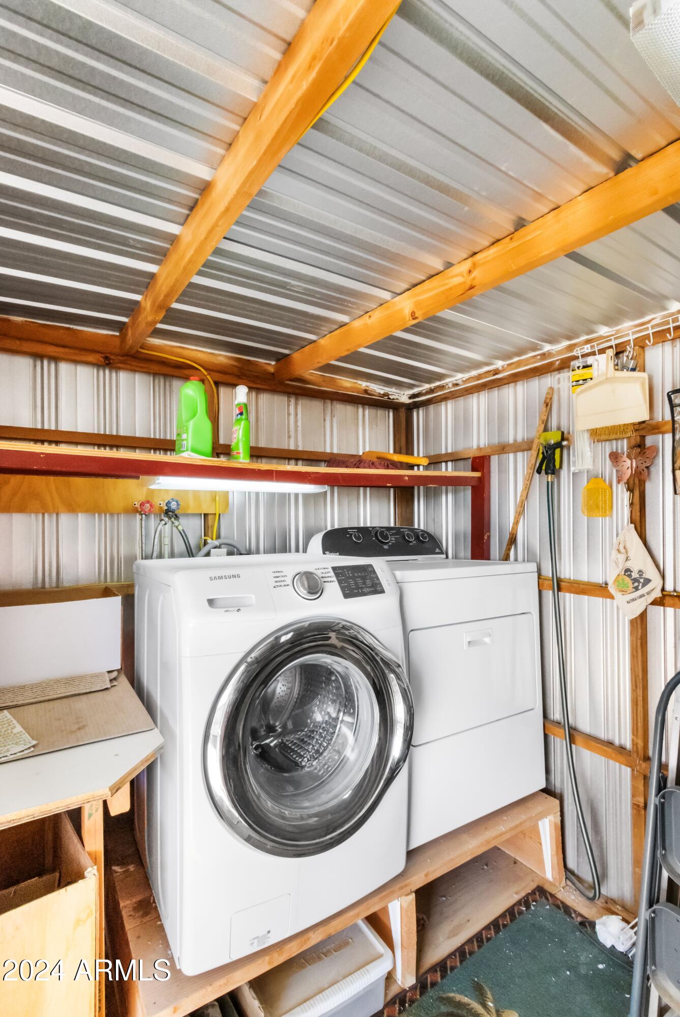 2100 North Trekell Road, Unit 204 Casa Grande, AZ 85122 - Photo 21 of 27 a utility room with dryer and washer