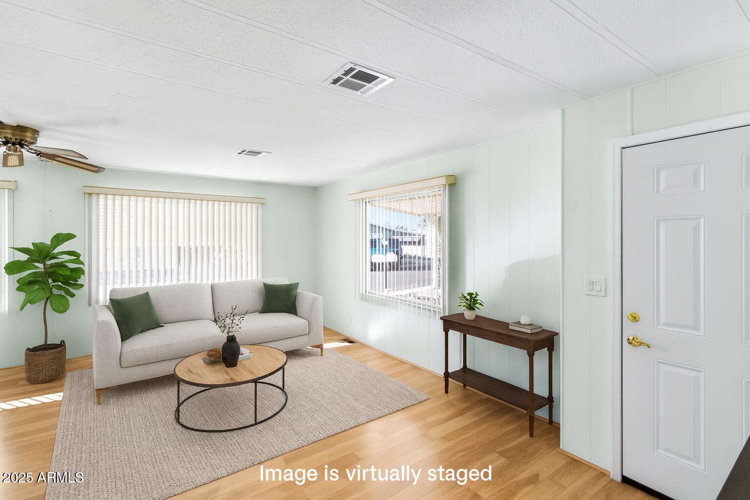 2100 North Trekell Road, Unit 204 Casa Grande, AZ 85122 - Photo 3 of 27 a living room with furniture and a potted plant