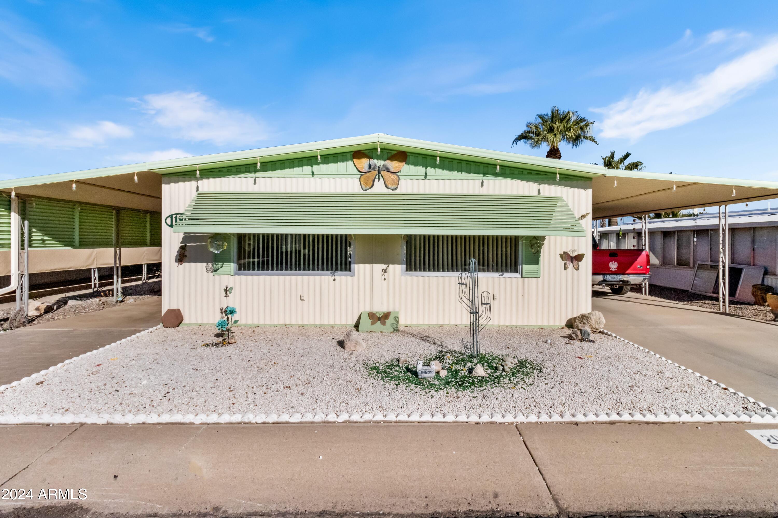 2100 North Trekell Road, Unit 204 Casa Grande, AZ 85122 - Photo 7 of 27 a front view of a building with a garage
