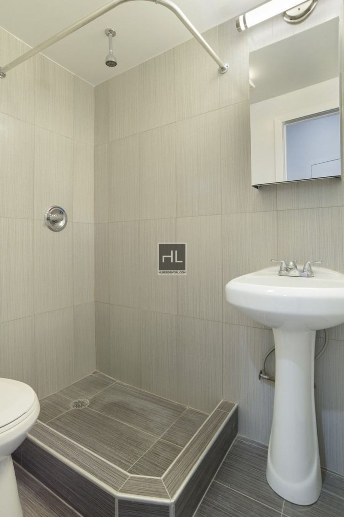 43 Cumberland Street, Unit UNT THREE Brooklyn, NY 11205 - Photo 7 of 9 a bathroom with a sink toilet and a mirror