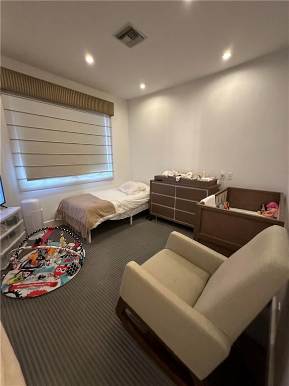 945 East 10th Street Brooklyn, NY 11230 - Photo 18 of 21 a living room with furniture and a couch