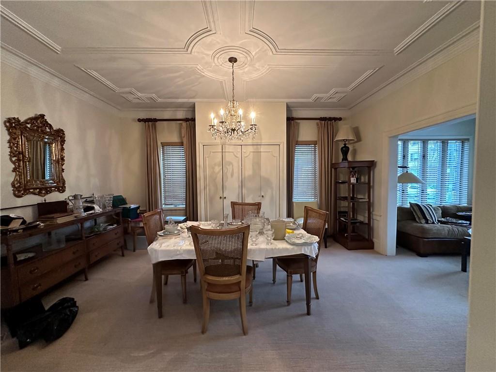 945 East 10th Street Brooklyn, NY 11230 - Photo 4 of 21 a view of a dining room with furniture window and outside view