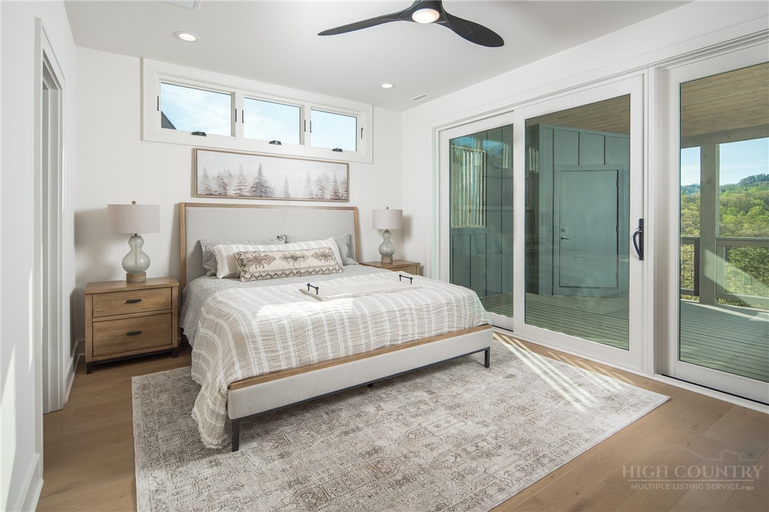 359 Calico Court Boone, NC 28607 - Photo 28 of 50 a bedroom with a bed and a large window
