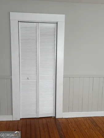 an empty room with wooden floor