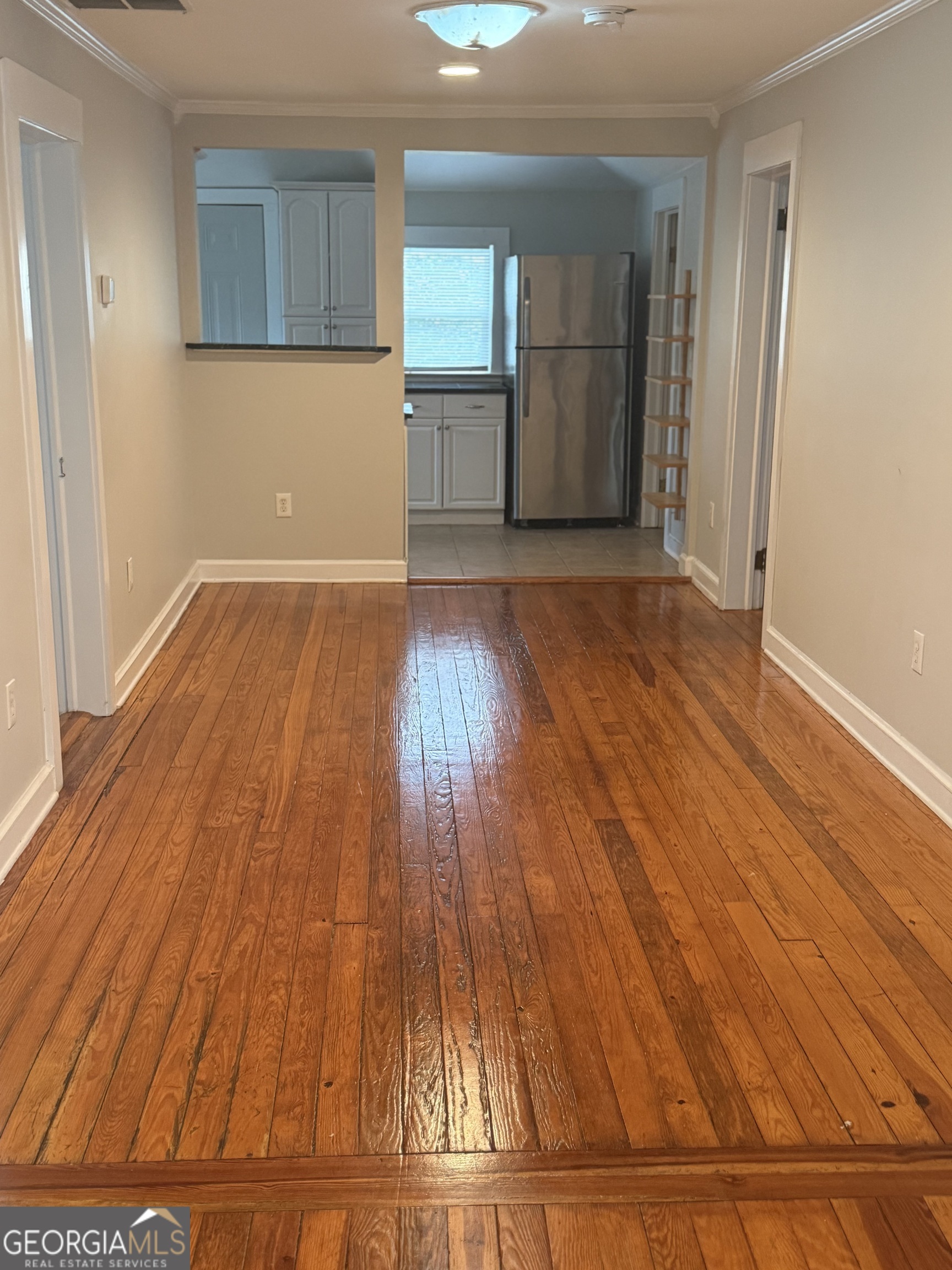 1750 Linwood Avenue East Point, GA 30344 - Photo 13 of 27 a view of empty room with wooden floor and entryway