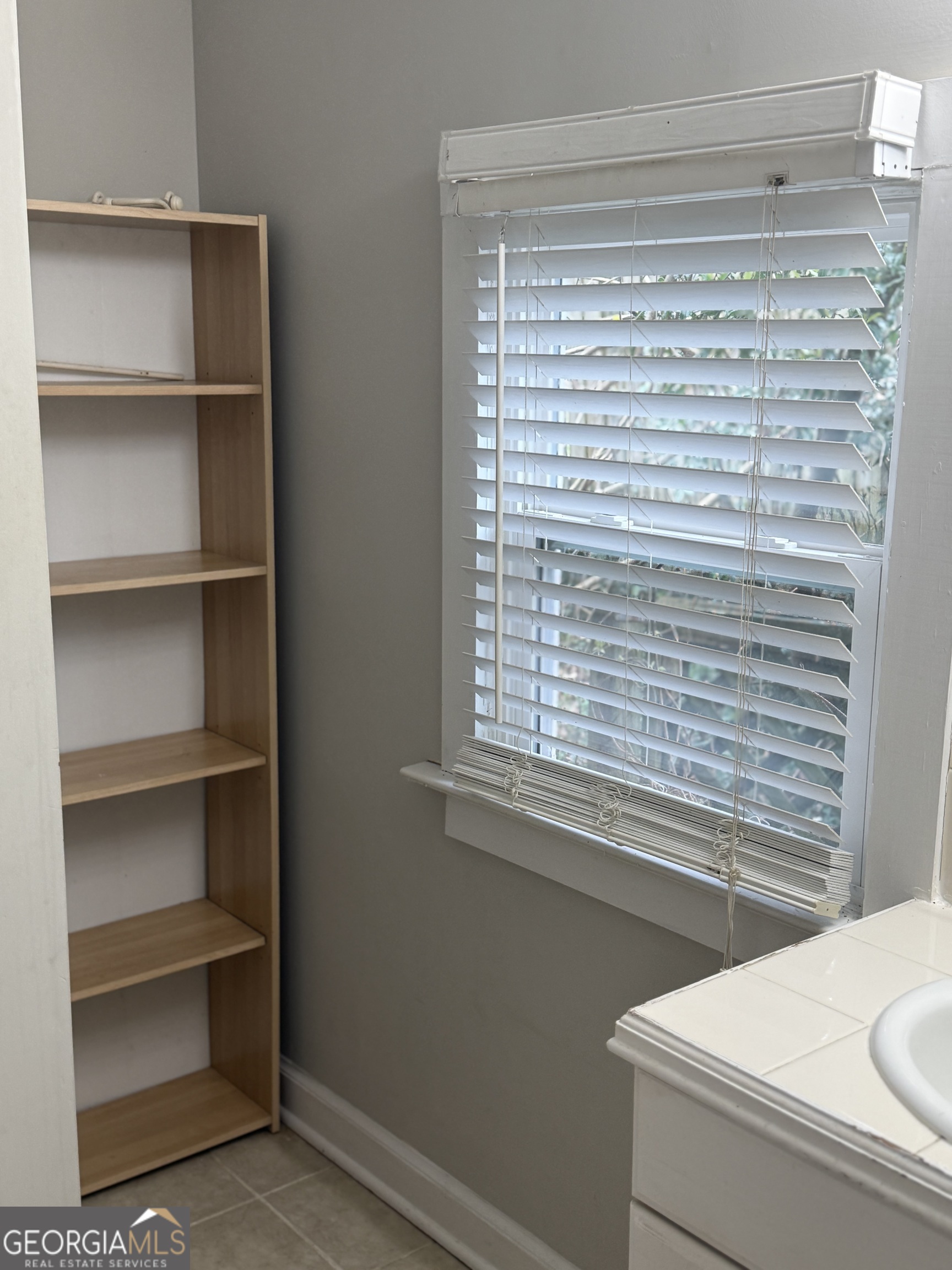 1750 Linwood Avenue East Point, GA 30344 - Photo 18 of 27 a bathroom with a toilet and a window