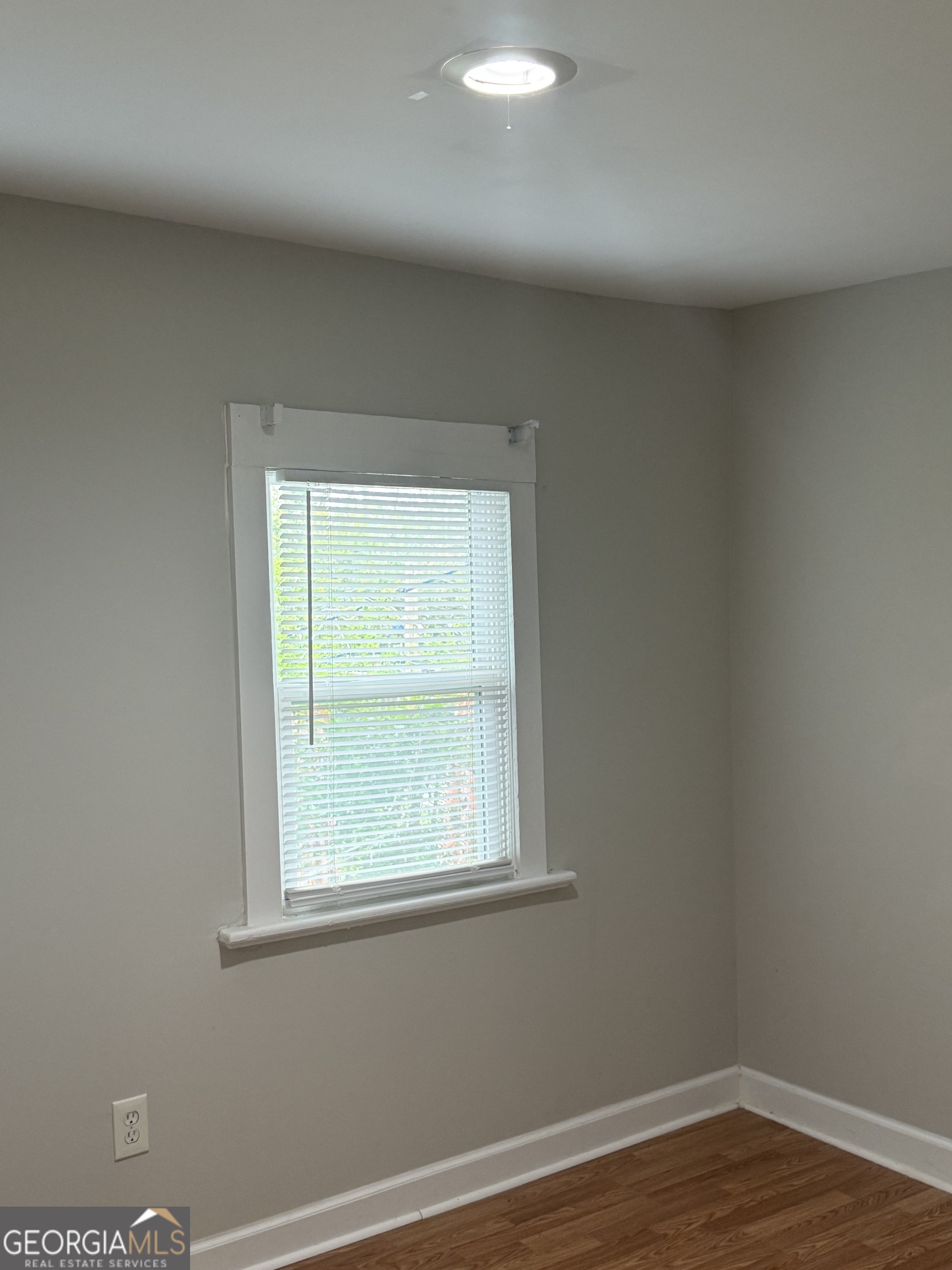 1750 Linwood Avenue East Point, GA 30344 - Photo 21 of 27 wooden floor in an empty room with a window
