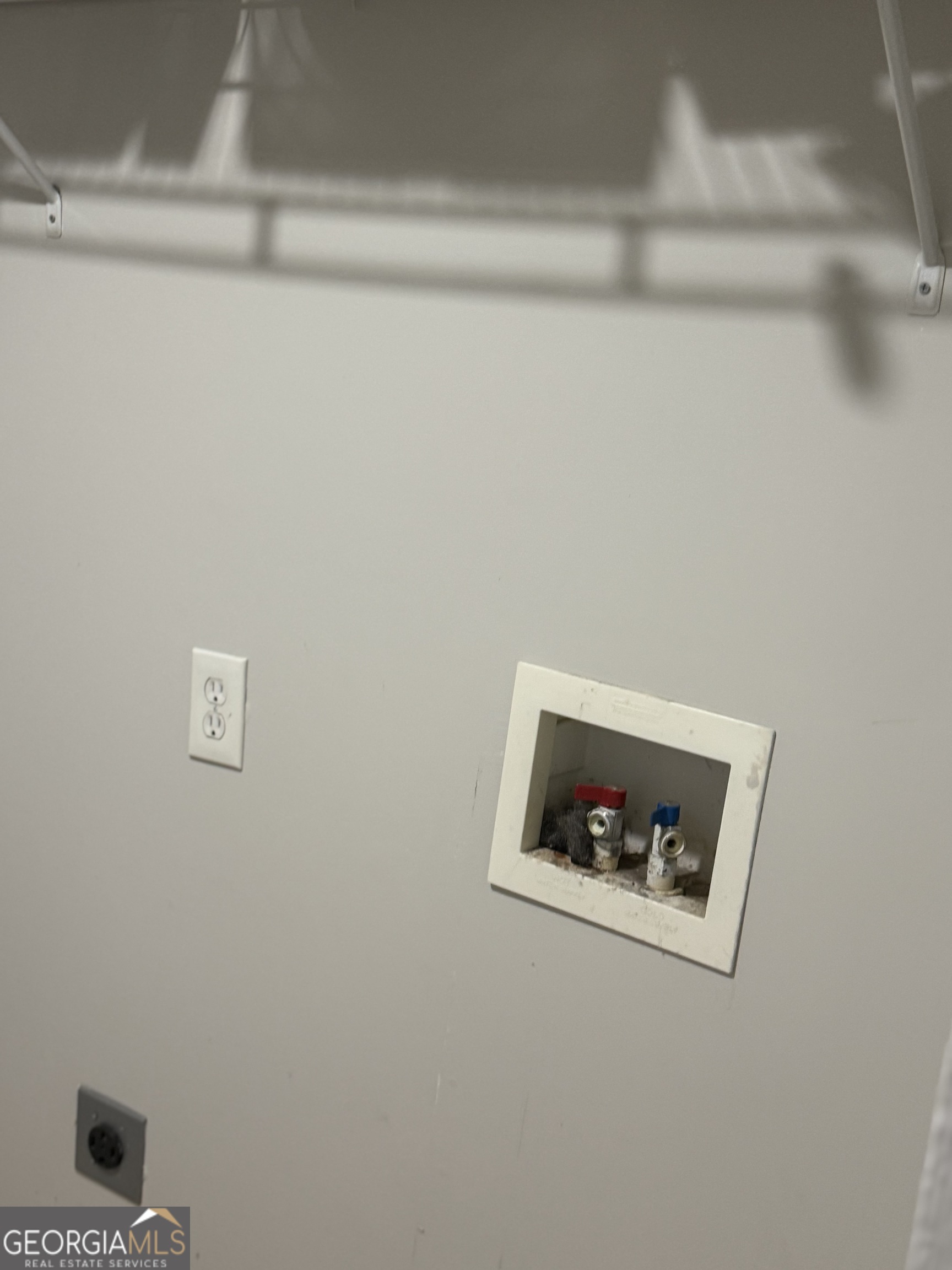 1750 Linwood Avenue East Point, GA 30344 - Photo 26 of 27 a white wall with a refrigerator in it