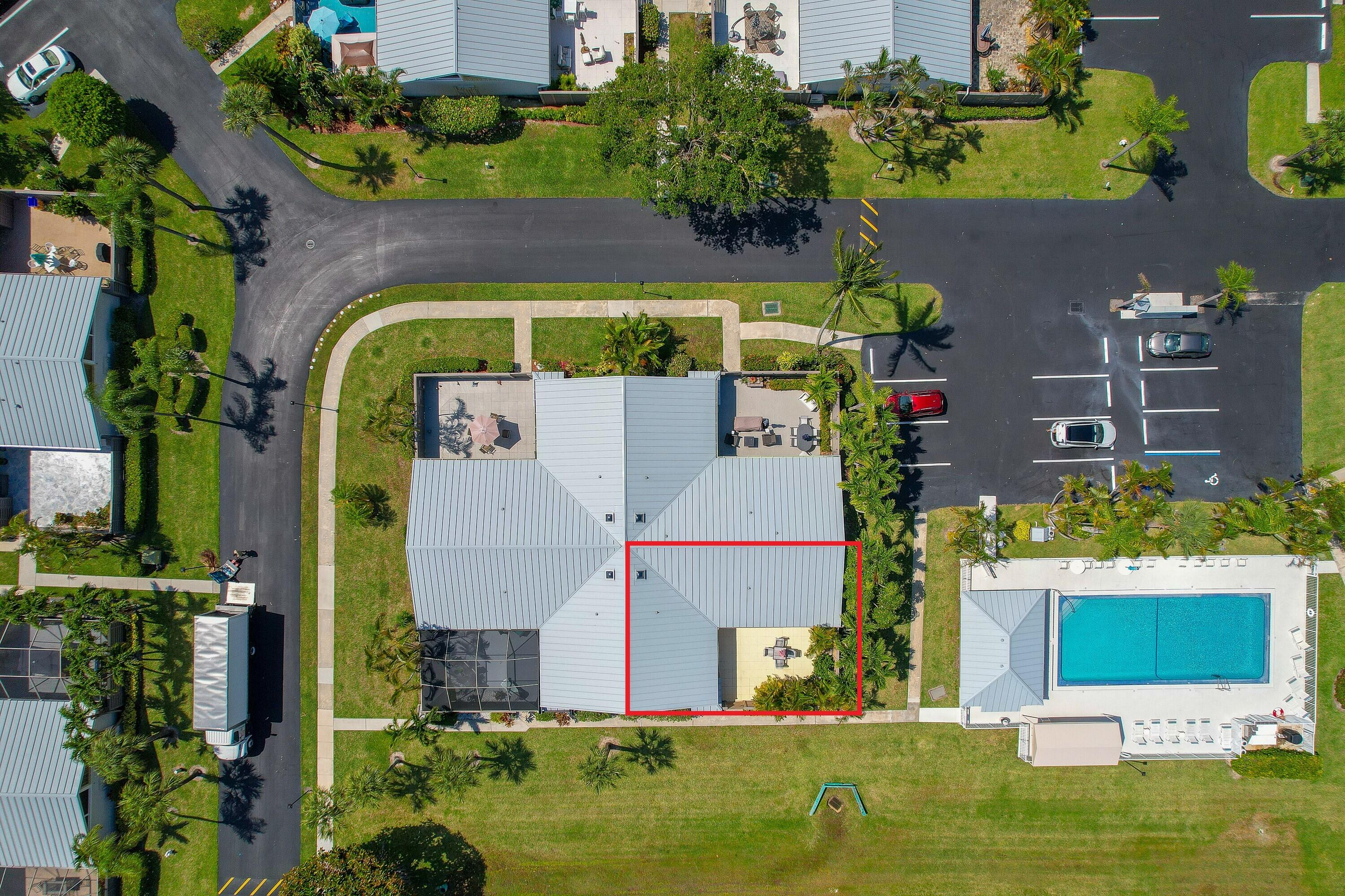 1801 Us Highway, Unit 18D Jupiter, FL 33477 - Photo 30 of 36 an aerial view of a house with a yard swimming pool and outdoor seating