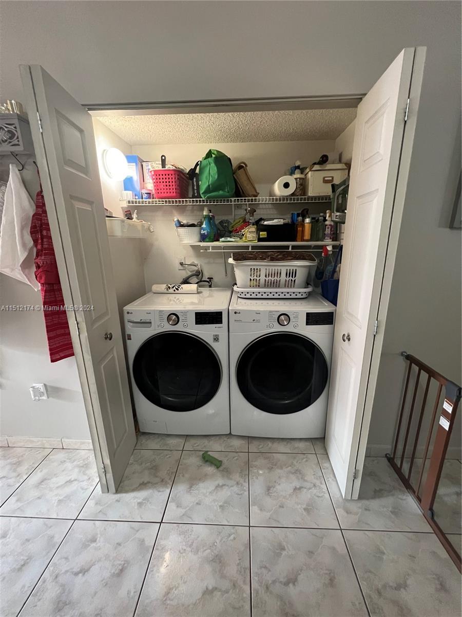 8118 Northwest 200th Street Hialeah, FL 33015 - Photo 17 of 24 a utility room with dryer and washer