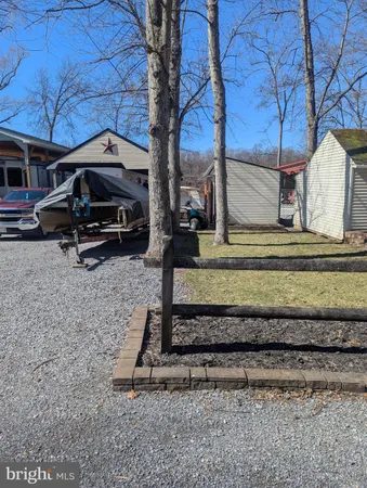 a view of a backyard with a car parked