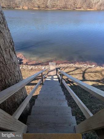a sitting area with wooden floor