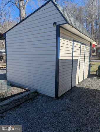 a view of backyard with cabin