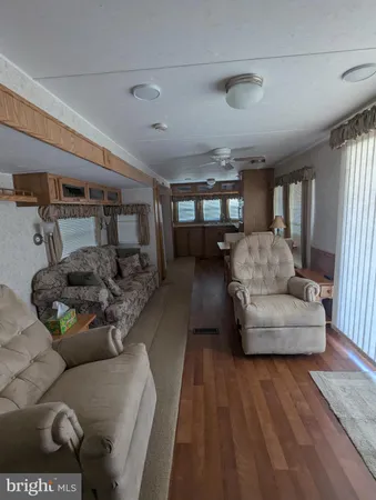 a kitchen with stainless steel appliances a refrigerator and a window
