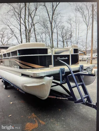 a view of a backyard with wooden fence