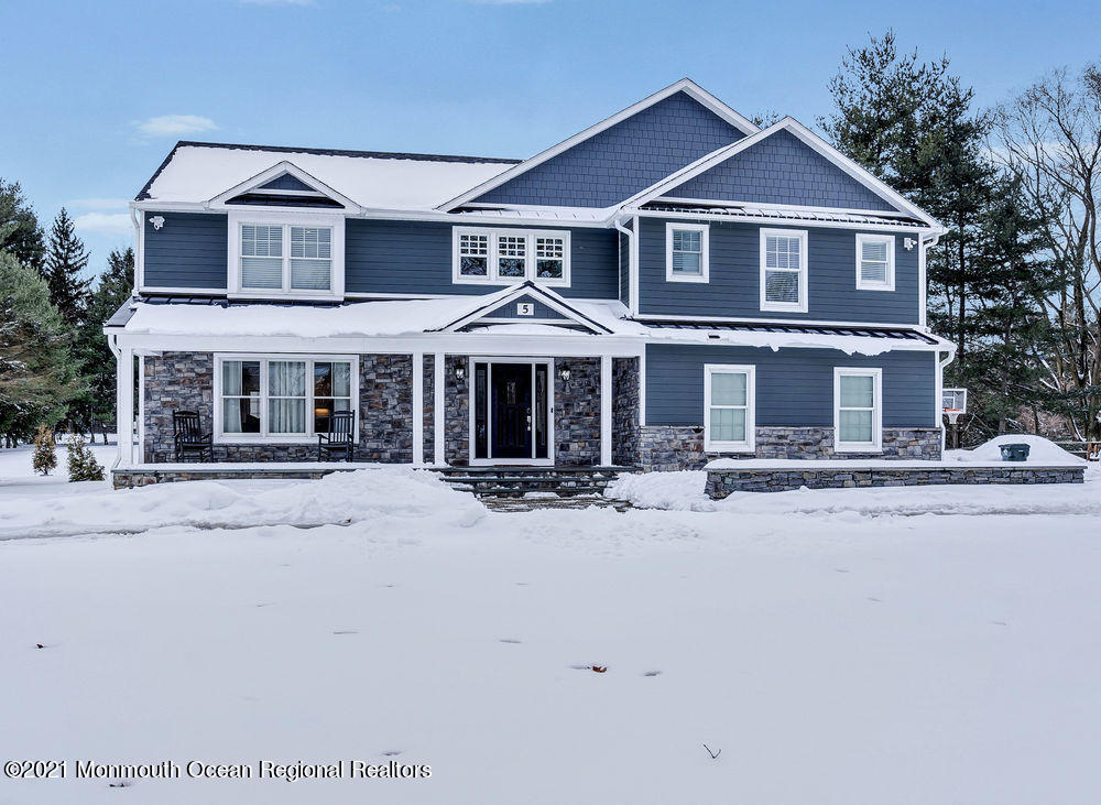 front view of a house with a yard