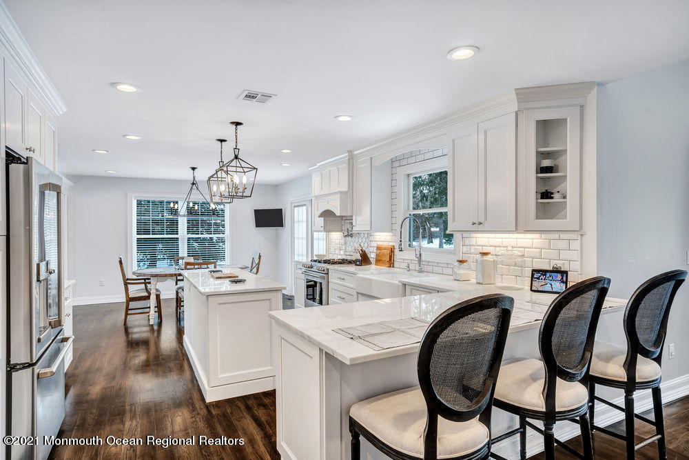 5 Cedar Drive Colts Neck, NJ 07722 - Photo 13 of 41 a large kitchen with a table and chairs