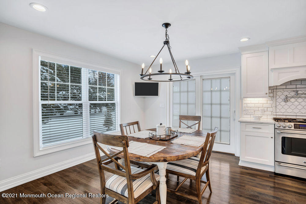 5 Cedar Drive Colts Neck, NJ 07722 - Photo 15 of 41 a view of a dining room with furniture window and wooden floor