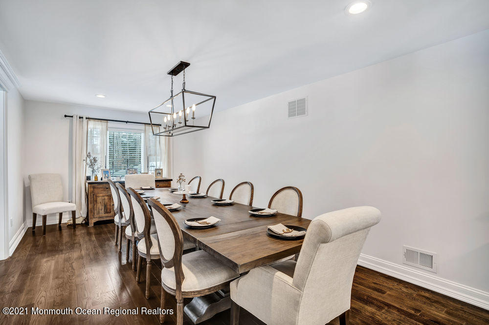5 Cedar Drive Colts Neck, NJ 07722 - Photo 18 of 41 a view of a dining room with furniture window and wooden floor