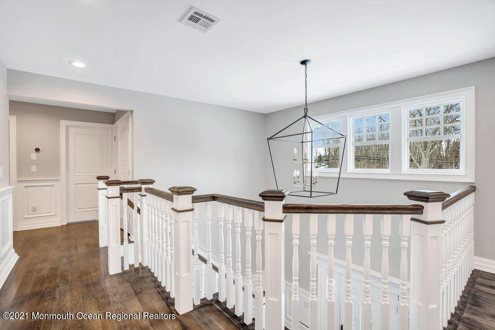 5 Cedar Drive Colts Neck, NJ 07722 - Photo 20 of 41 a view of a hallway with windows