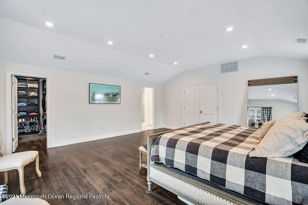 5 Cedar Drive Colts Neck, NJ 07722 - Photo 21 of 41 a bedroom with a bed and a cabinets