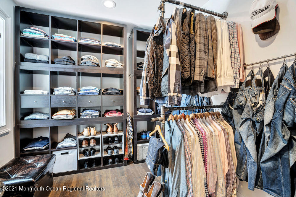 5 Cedar Drive Colts Neck, NJ 07722 - Photo 24 of 41 a view of walk in closet with clothes and shoes