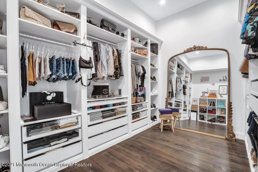 5 Cedar Drive Colts Neck, NJ 07722 - Photo 25 of 41 a view of walk in closet with clothes and shoes