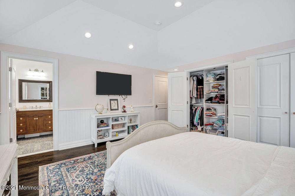 5 Cedar Drive Colts Neck, NJ 07722 - Photo 30 of 41 a bedroom with a bed and a television