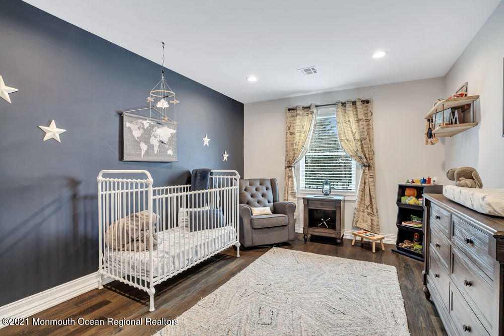 5 Cedar Drive Colts Neck, NJ 07722 - Photo 32 of 41 a bedroom with furniture and a window