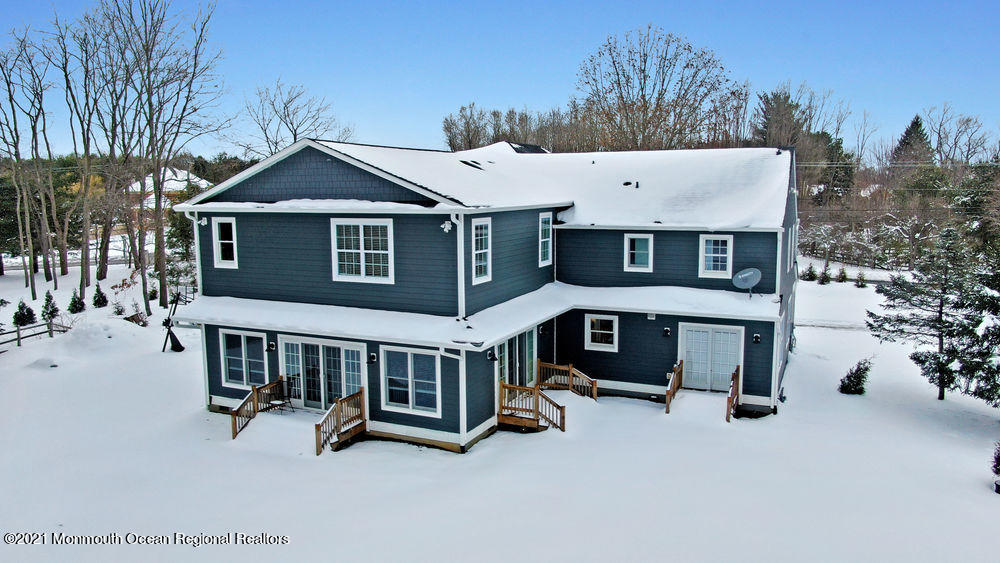 5 Cedar Drive Colts Neck, NJ 07722 - Photo 40 of 41 a view of a house with a yard patio and backyard