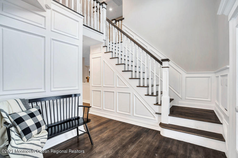 5 Cedar Drive Colts Neck, NJ 07722 - Photo 5 of 41 a view of entryway with wooden floor and stairs