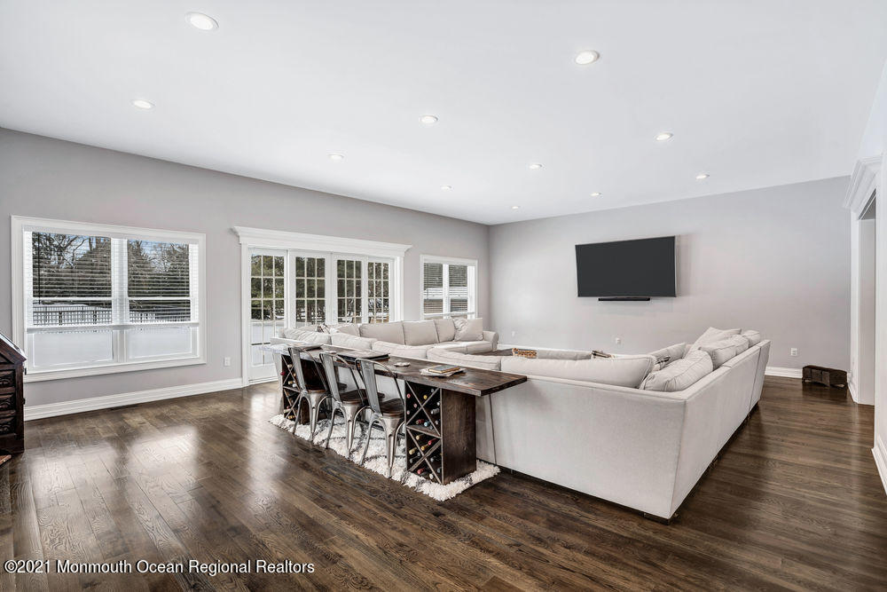 5 Cedar Drive Colts Neck, NJ 07722 - Photo 8 of 41 a living room with fireplace furniture and a flat screen tv