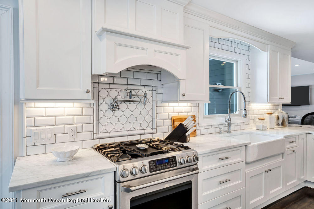 5 Cedar Drive Colts Neck, NJ 07722 - Photo 10 of 41 a kitchen with granite countertop a stove and a sink