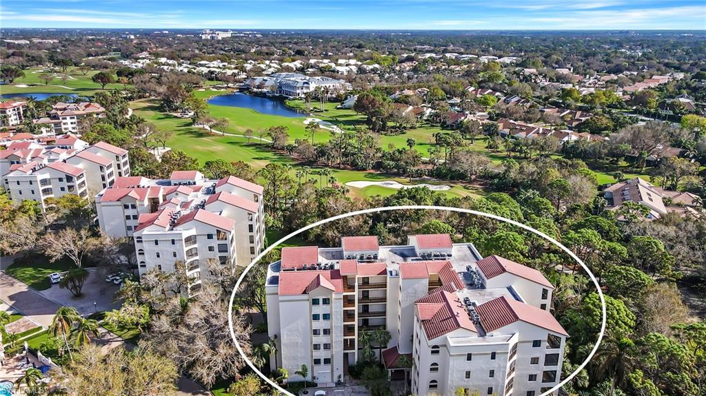 6500 Valen Way, Unit A203 Naples, FL 34108 - Photo 14 of 18 Bird's eye view featuring view of golf course, a water view, and a residential view