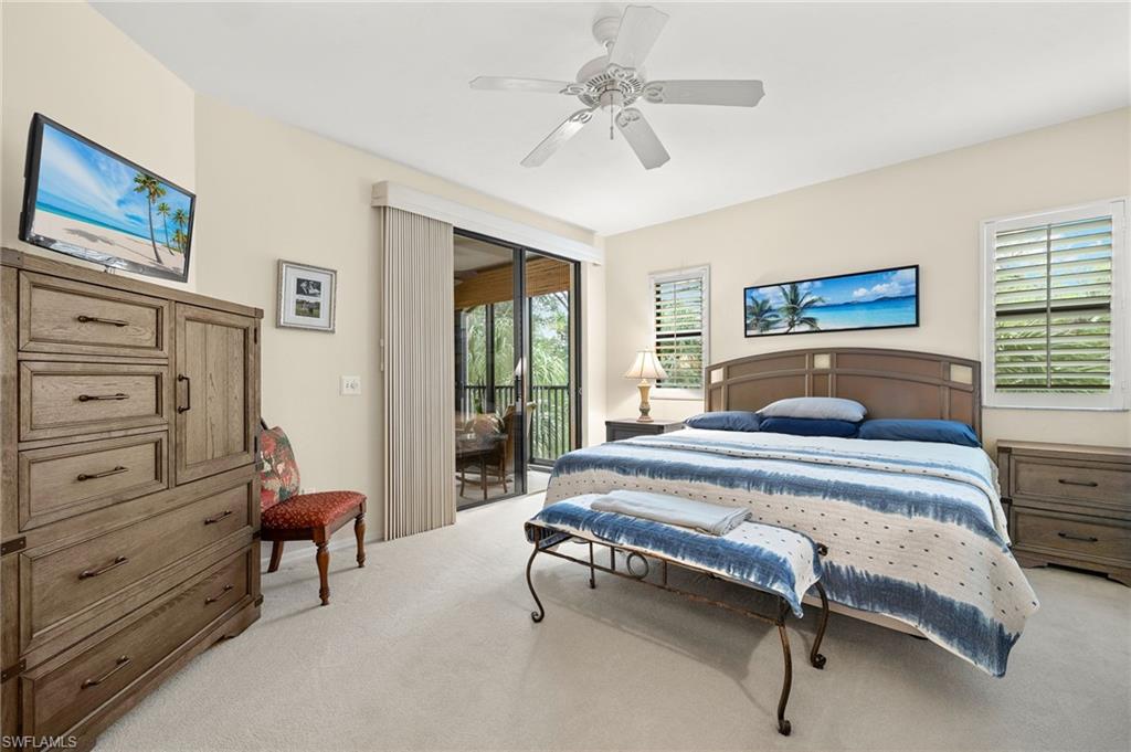 6500 Valen Way, Unit A203 Naples, FL 34108 - Photo 5 of 18 Bedroom with light carpet, ceiling fan, and access to outside