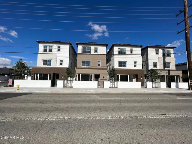 a front view of a building with a street