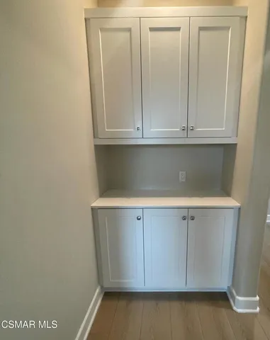 a kitchen with a sink and a refrigerator