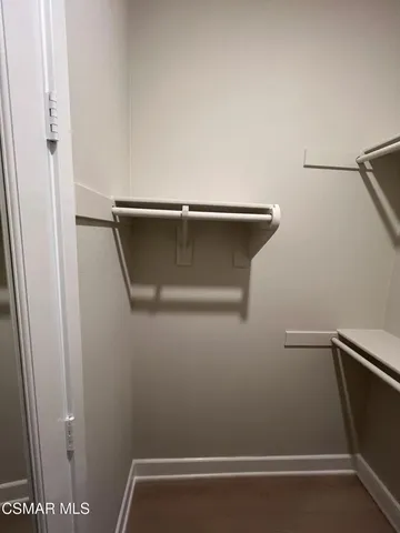 a view of room with window and hardwood floor