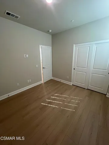 a view of a house with pool and sitting area